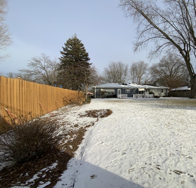 view of yard covered in snow