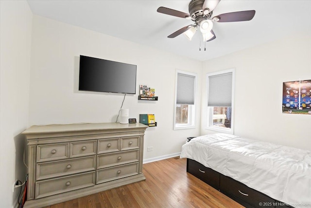 bedroom featuring light hardwood / wood-style floors and ceiling fan