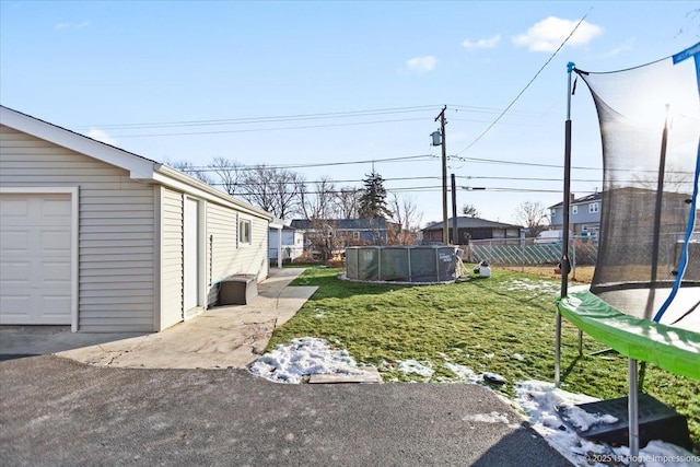 view of yard with a trampoline