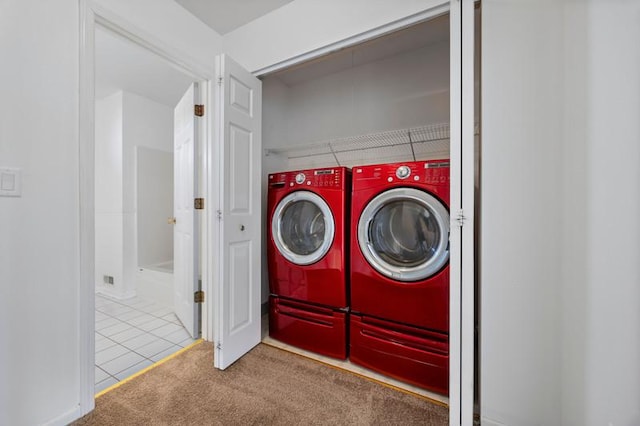 laundry room with independent washer and dryer and carpet flooring