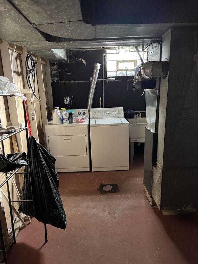 interior space featuring washing machine and dryer and sink