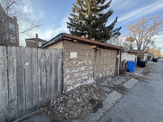 view of property exterior with an outbuilding and a garage