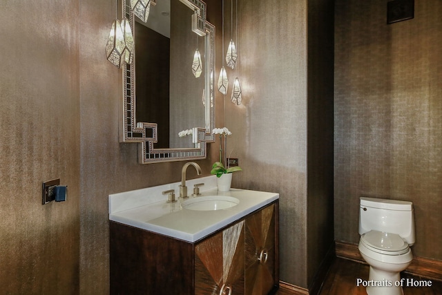 bathroom with vanity and toilet