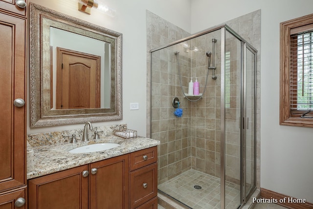 bathroom with vanity and an enclosed shower