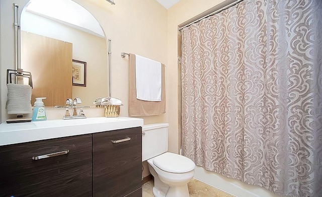 bathroom with vanity, tile patterned flooring, and toilet