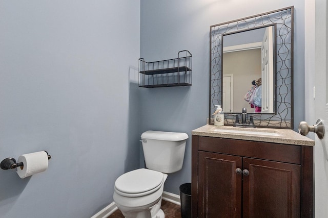 bathroom with vanity, wood-type flooring, and toilet