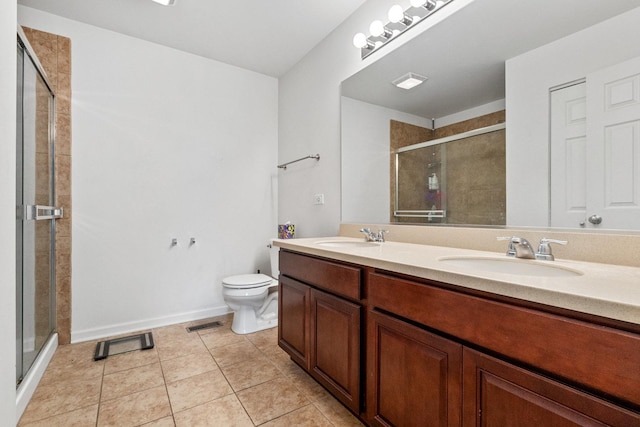 bathroom with vanity, toilet, an enclosed shower, and tile patterned flooring