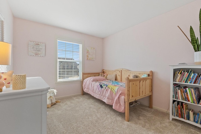 bedroom featuring light carpet