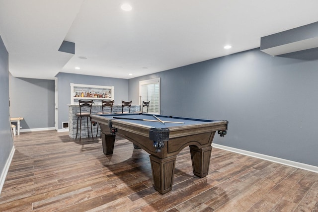 rec room featuring hardwood / wood-style flooring, pool table, and indoor bar