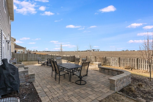 view of patio featuring a rural view and grilling area