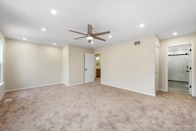 carpeted empty room with ceiling fan