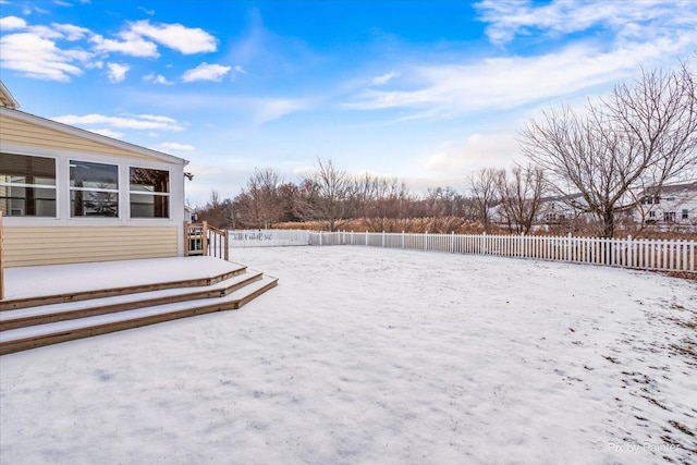 view of yard covered in snow