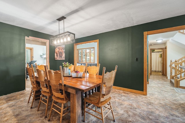 dining area with a textured ceiling