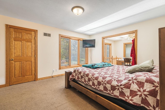 bedroom featuring light colored carpet