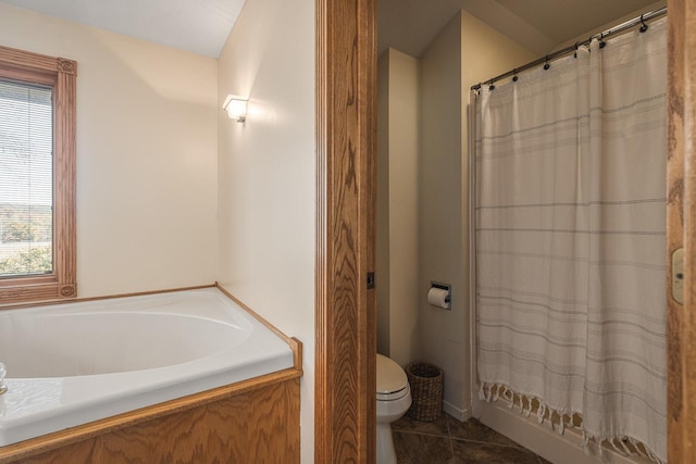 bathroom featuring tile patterned flooring and toilet