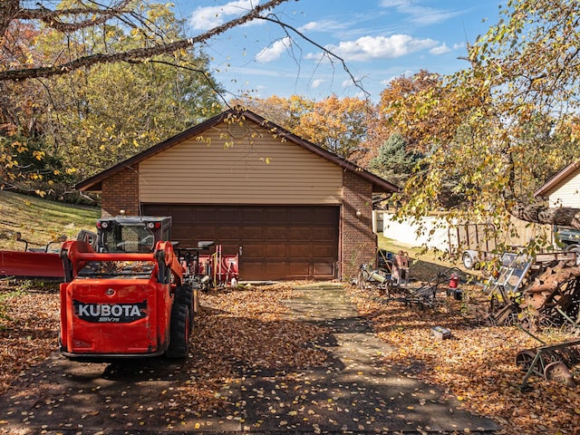 view of property exterior featuring an outbuilding and a garage