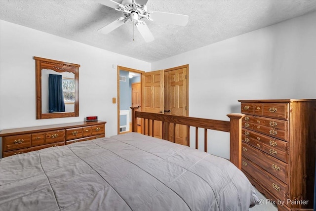 bedroom featuring a textured ceiling and ceiling fan