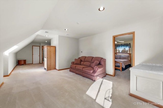 carpeted living room with vaulted ceiling