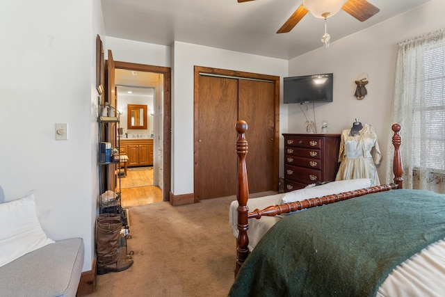 carpeted bedroom with a closet and ceiling fan