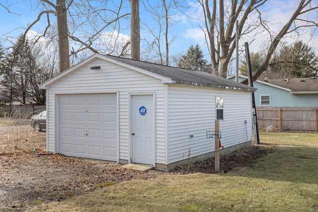 garage with a yard