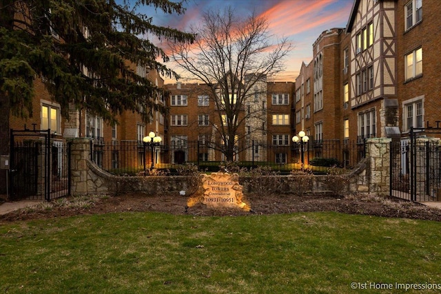 view of property's community with a lawn