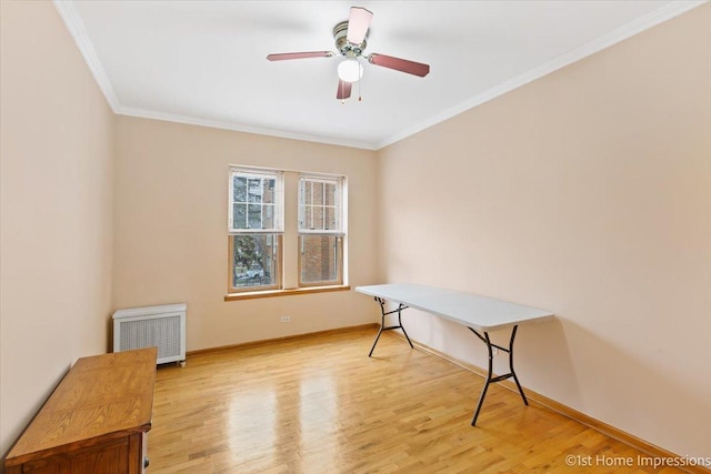 home office featuring crown molding, radiator heating unit, ceiling fan, and light wood-type flooring