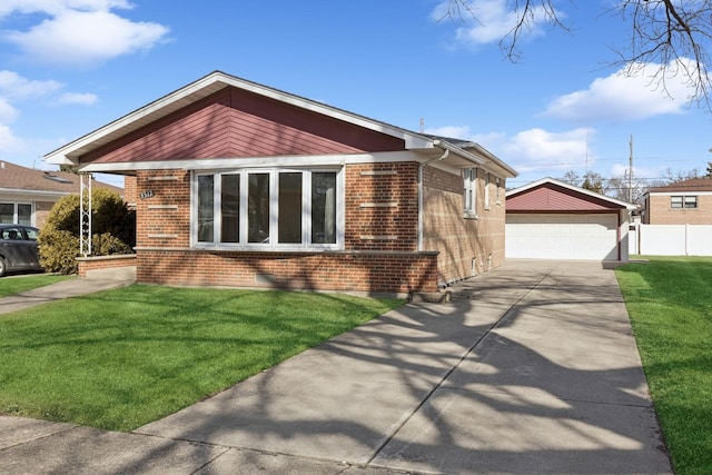 view of front of house featuring a detached garage, fence, an outdoor structure, a front lawn, and brick siding