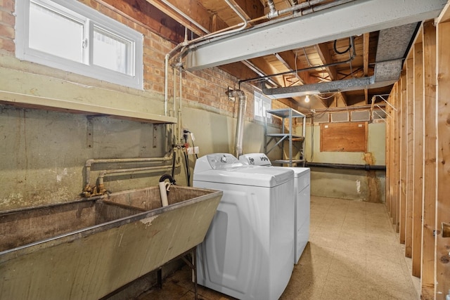 laundry area featuring laundry area, washer and dryer, and tile patterned floors