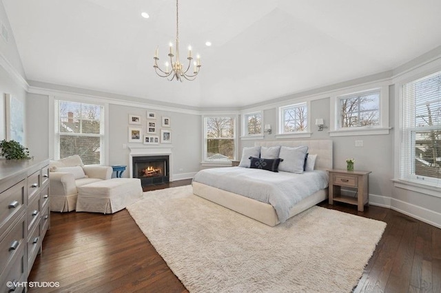 bedroom with multiple windows, a notable chandelier, crown molding, and dark hardwood / wood-style floors