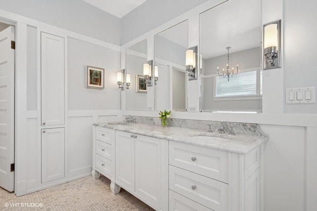 bathroom featuring vanity, a notable chandelier, and tile patterned flooring