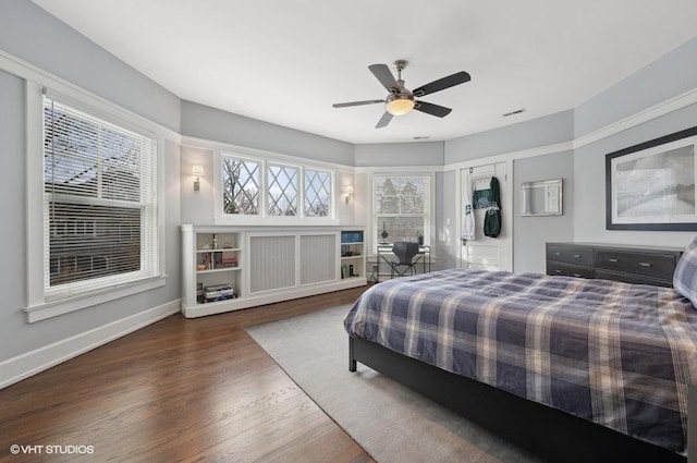 bedroom featuring dark wood-type flooring and ceiling fan