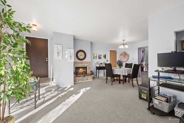 dining room featuring carpet and an inviting chandelier