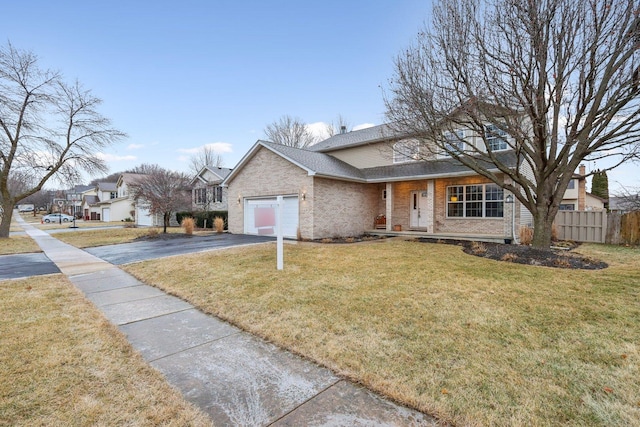 view of front facade featuring a garage and a front yard