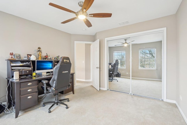 office space with ceiling fan and light colored carpet