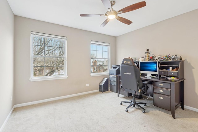 office with light carpet and ceiling fan