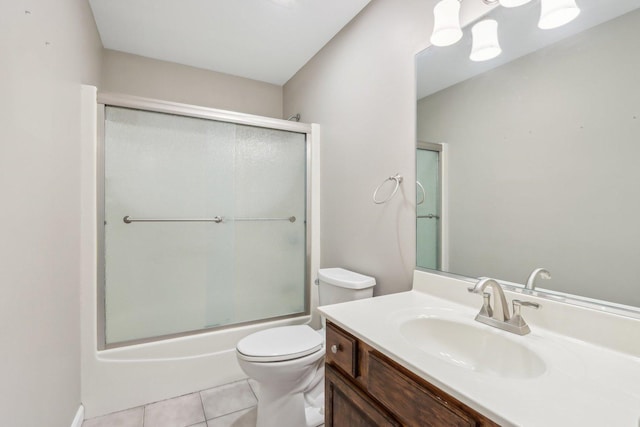 full bathroom featuring tile patterned flooring, vanity, enclosed tub / shower combo, and toilet