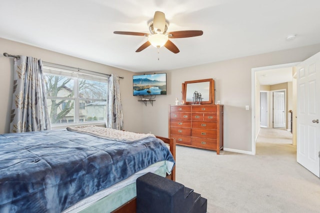 bedroom featuring ceiling fan and light colored carpet