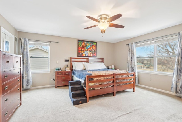 bedroom with ceiling fan and light colored carpet