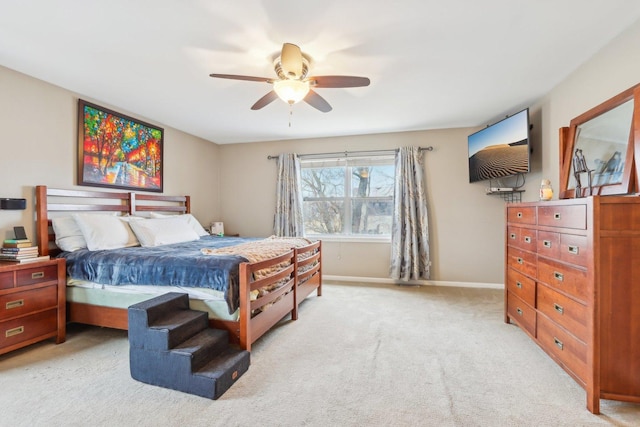 bedroom with light carpet and ceiling fan