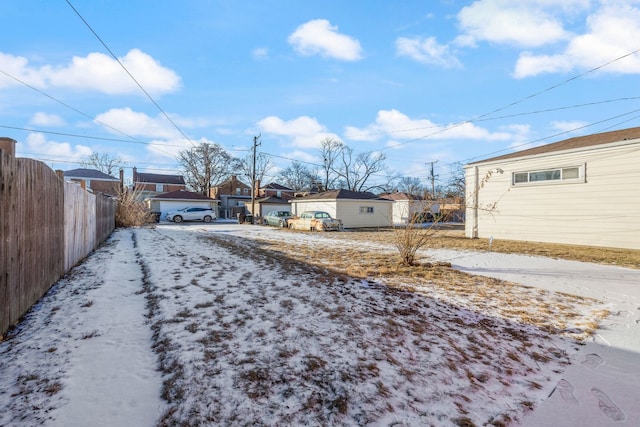 view of yard layered in snow