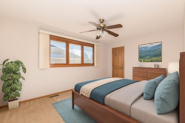 bedroom featuring hardwood / wood-style floors and ceiling fan