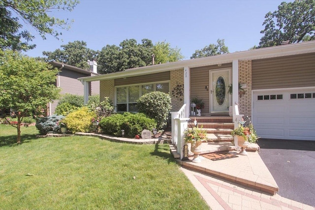 ranch-style home with a garage and a front lawn