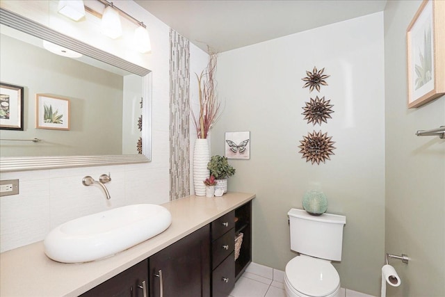 bathroom with vanity, tile patterned flooring, and toilet