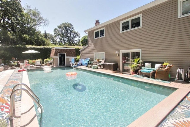 view of pool with a shed