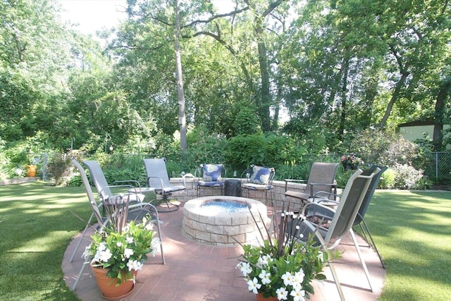 view of patio with a fire pit