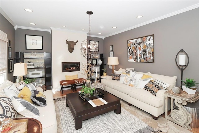 living room with crown molding, an inviting chandelier, and light hardwood / wood-style flooring