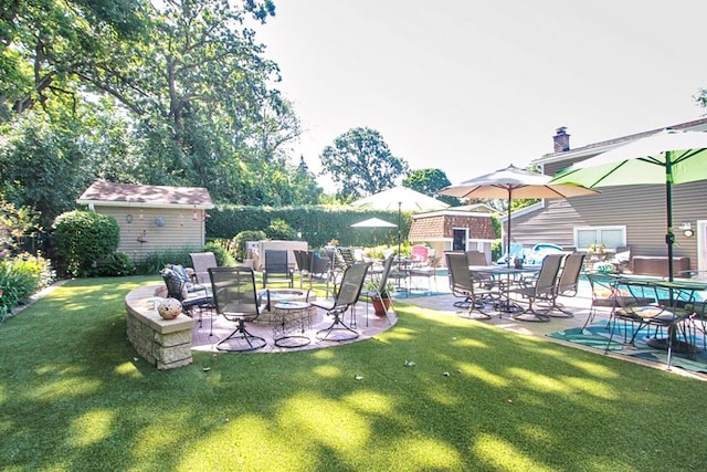 view of yard featuring a patio area and a shed