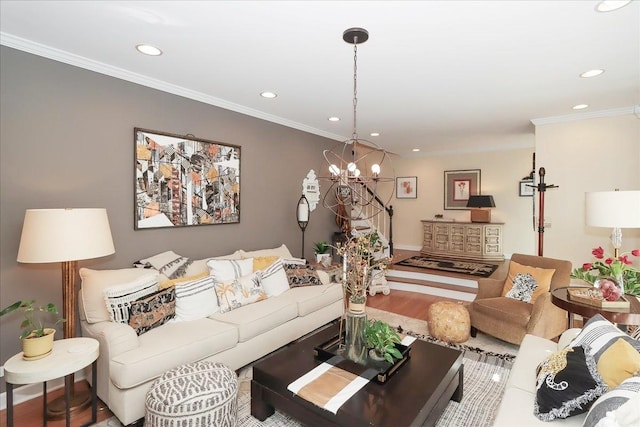 living room with an inviting chandelier, wood-type flooring, and ornamental molding