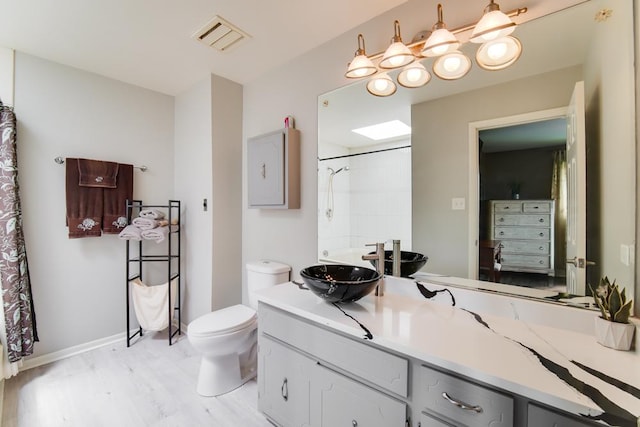 12850 S Westport Dr, Palos Park, IL 60464 - full bathroom with vanity, toilet, a shower with shower curtain, and wood finished floors