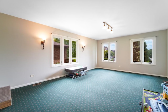 12850 S Westport Dr, Palos Park, IL 60464 - empty room featuring carpet floors, baseboards, and track lighting